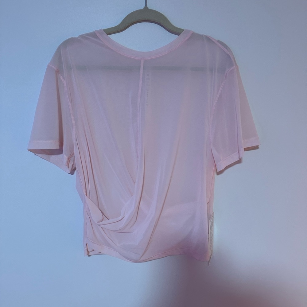 New with tags. Lightweight Mesh Reversible Yoga T shirt baby pink size 12/L
